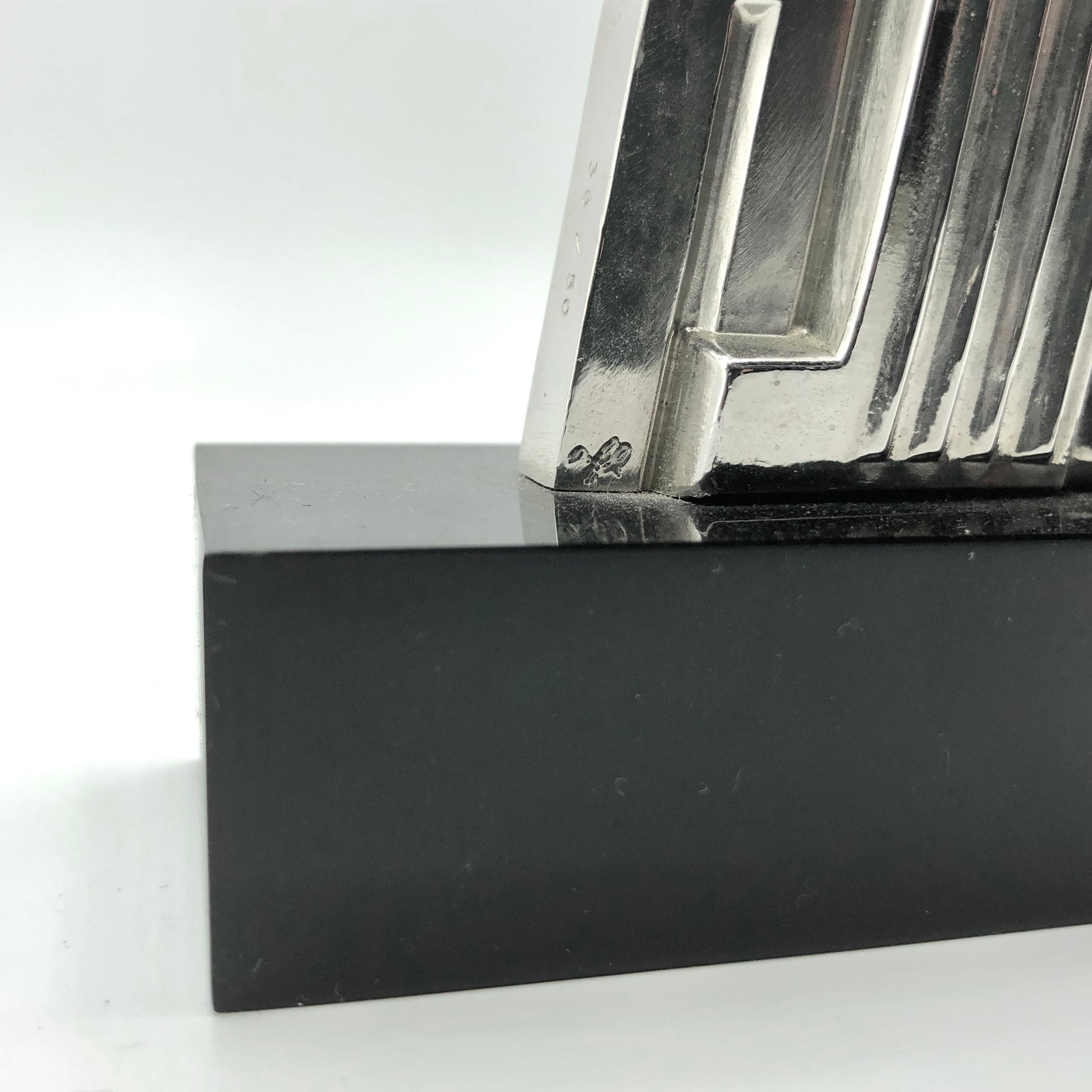Roy Lichtenstein
Salute to Airmail, 1968
solid silver limited edition of 50 
Roy Lichtenstein incised initials on bottom of sculpture 