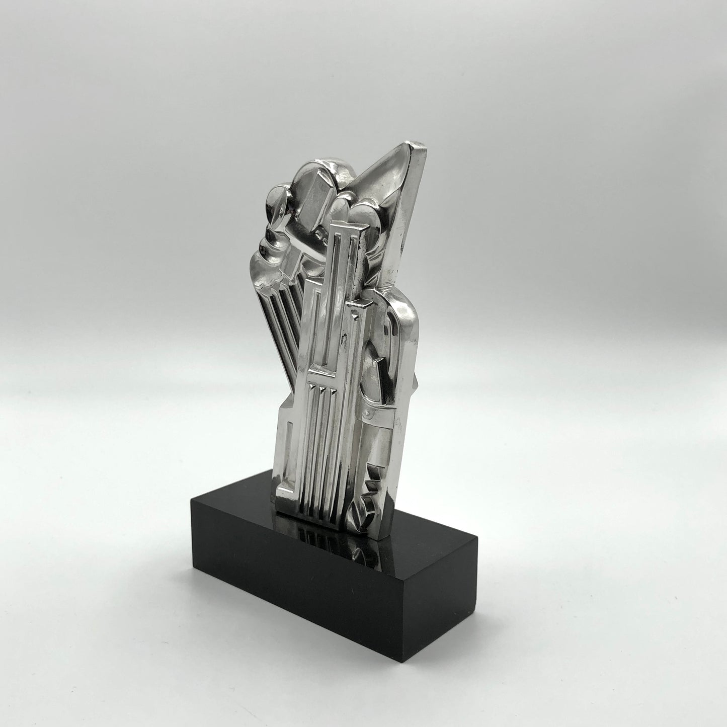 Roy Lichtenstein
Salute to Airmail, 1968
solid silver multiple on black plexi base 