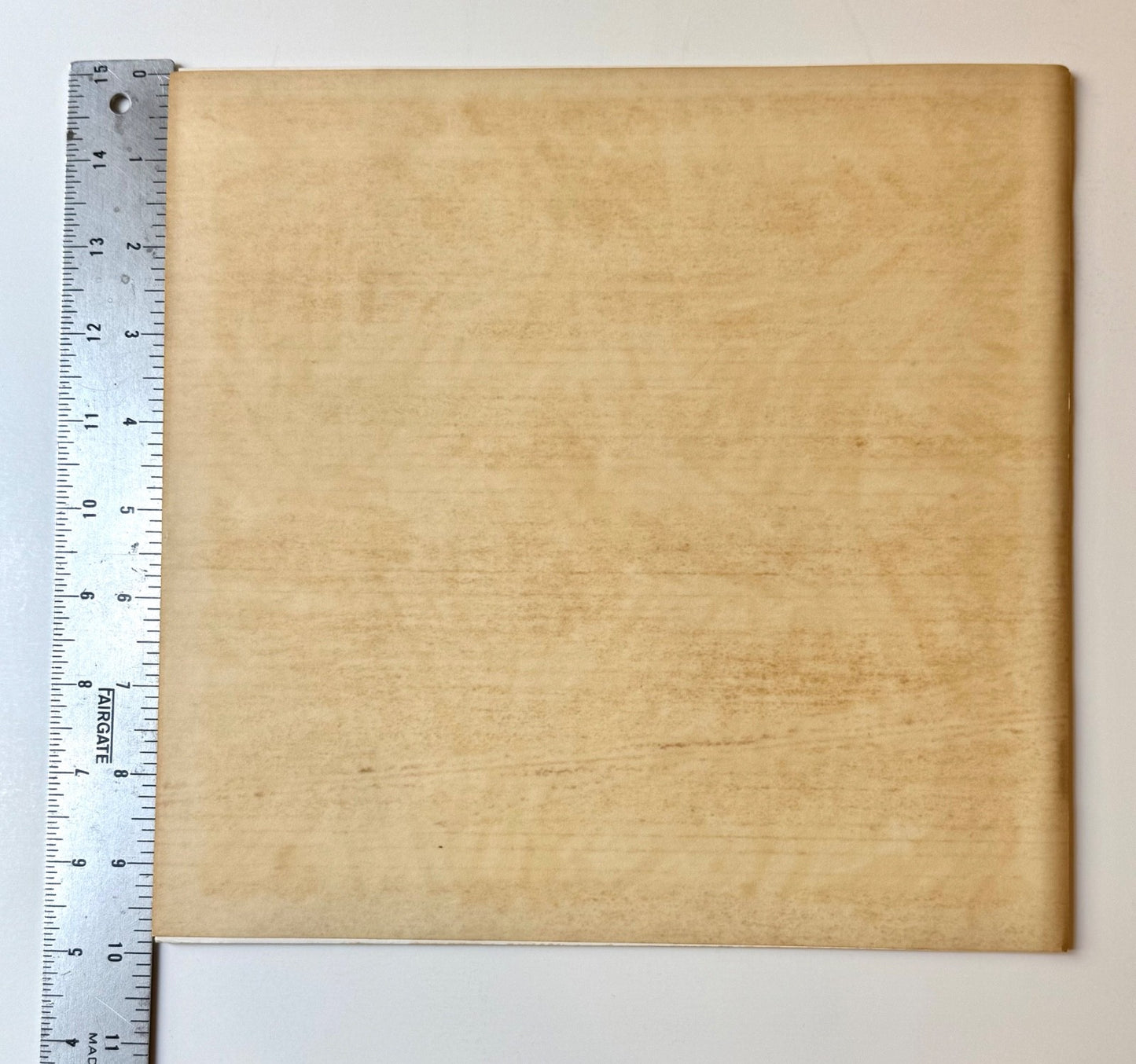 Ruler shows correct dust jacket vertical dimensions of  9 13/16 inches for verso back cover dust jacket that wraps around Jasper Johns/Screenprints exhibition catalog. 